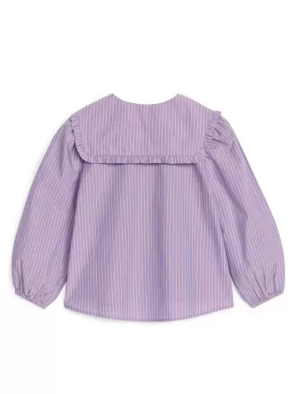 Blusa con cuello con volantes