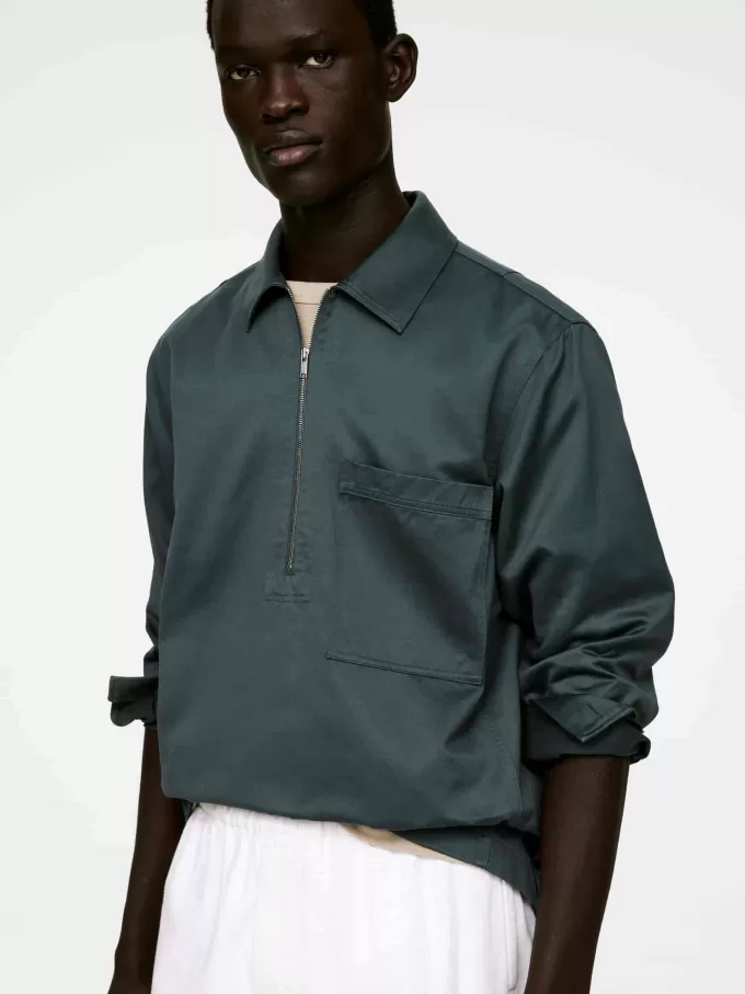 Camisa holgada con pop-over Camisa holgada con pop-over