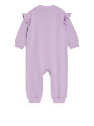 Mono de rizo francés con volantes