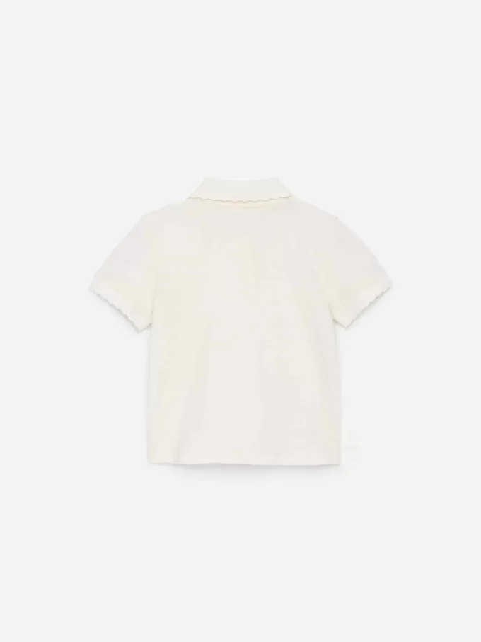 Polo con borde festoneado Polo con borde festoneado