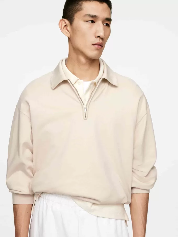 Polo con media cremallera Polo con media cremallera