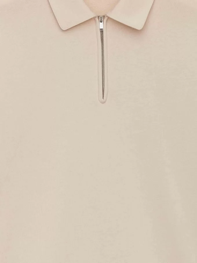 Polo con media cremallera Polo con media cremallera