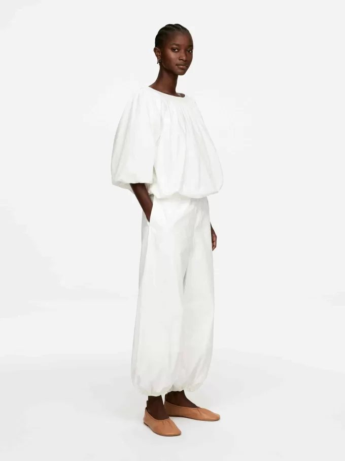 Top con dobladillo abullonado Top con dobladillo abullonado