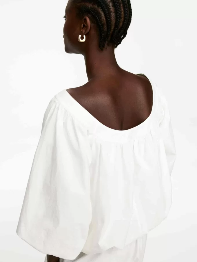 Top con dobladillo abullonado Top con dobladillo abullonado