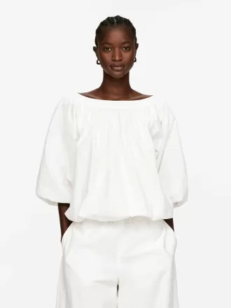 Top con dobladillo abullonado