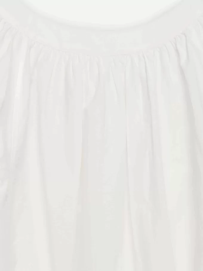 Top con dobladillo abullonado Top con dobladillo abullonado